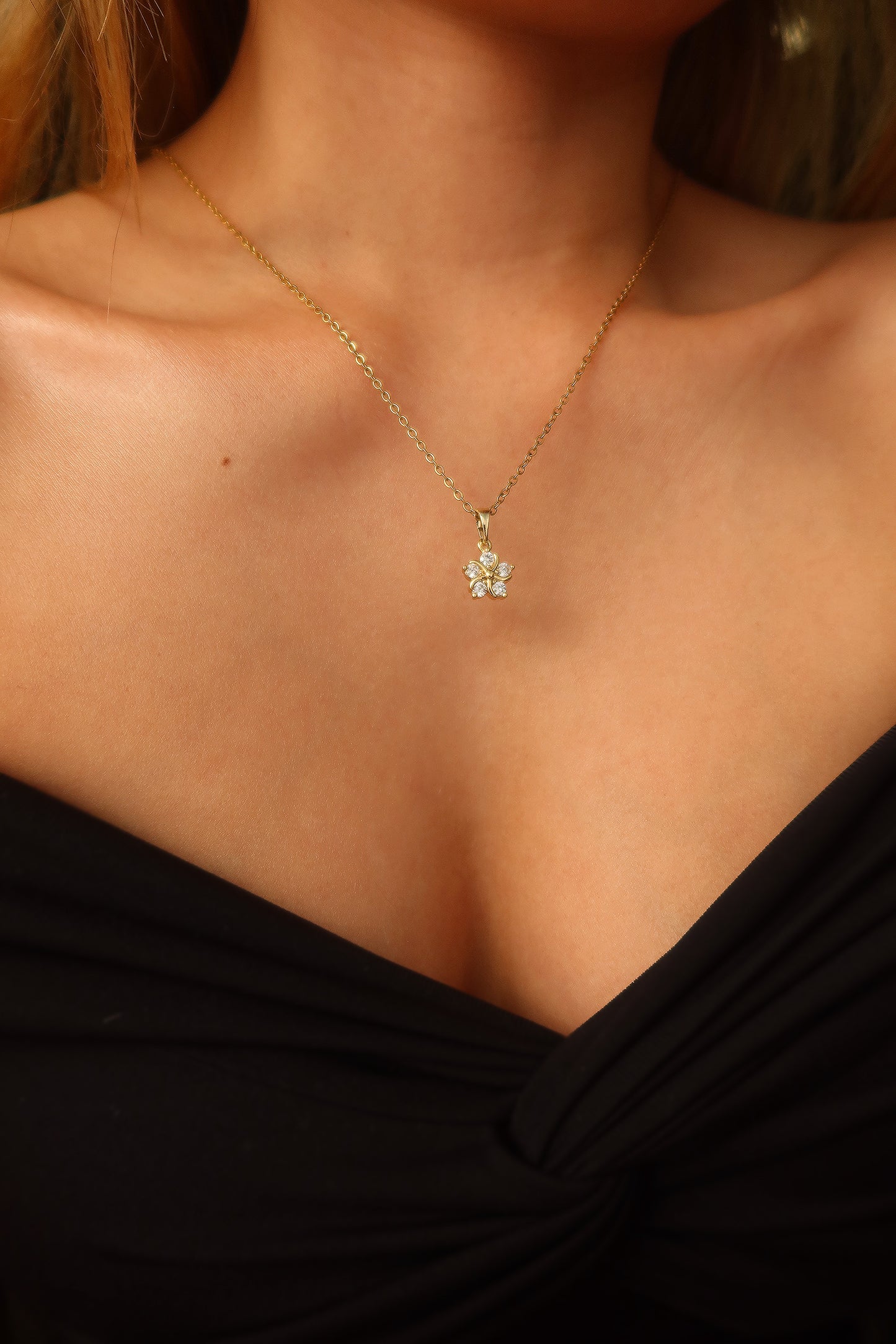 Close up of Healing Flower Necklace on model, tarnish resistant necklace. By DBL Jewelry