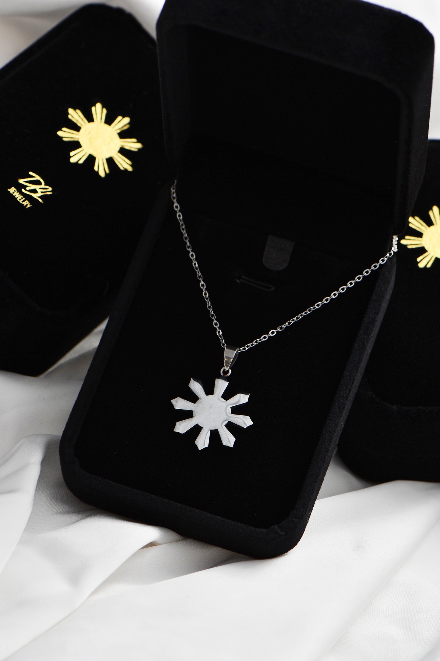 Silver Mabuhay Sun necklace in Exclusive DBL Velvet Box.