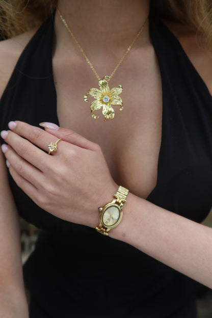 Close-Up Model of 24K Gold Filled Sampaguita Flower Ring, size 40 mm known for Healing, Strength and Positivity.by DBL JEWELRY. With Gold Watch