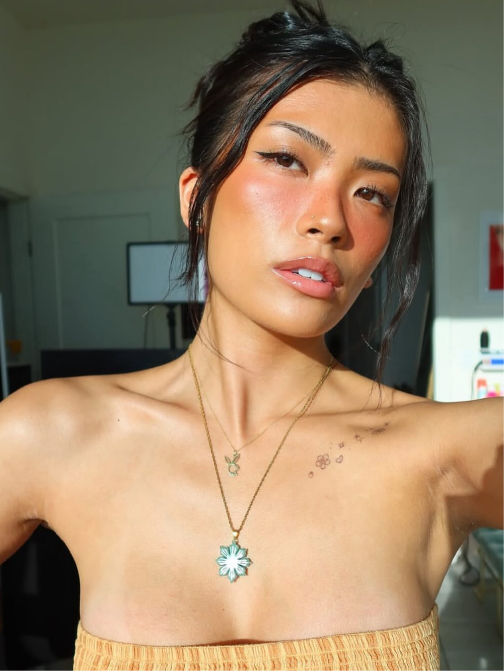 Model wearing 18K Gold Plated Jade Mabuhay Sun Necklace by DBL Jewelry