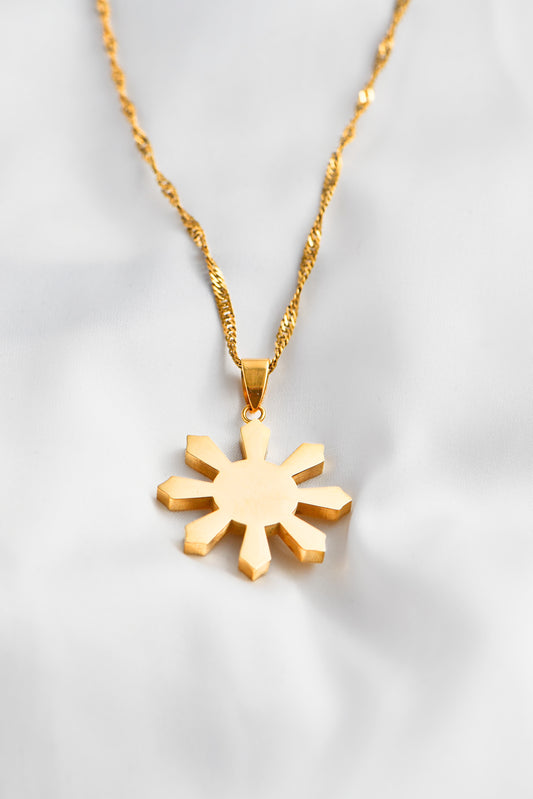 18K Gold Plated Mabuhay Sun on white background. Waterproof & Tarnish Resistant. By DBL Jewelry