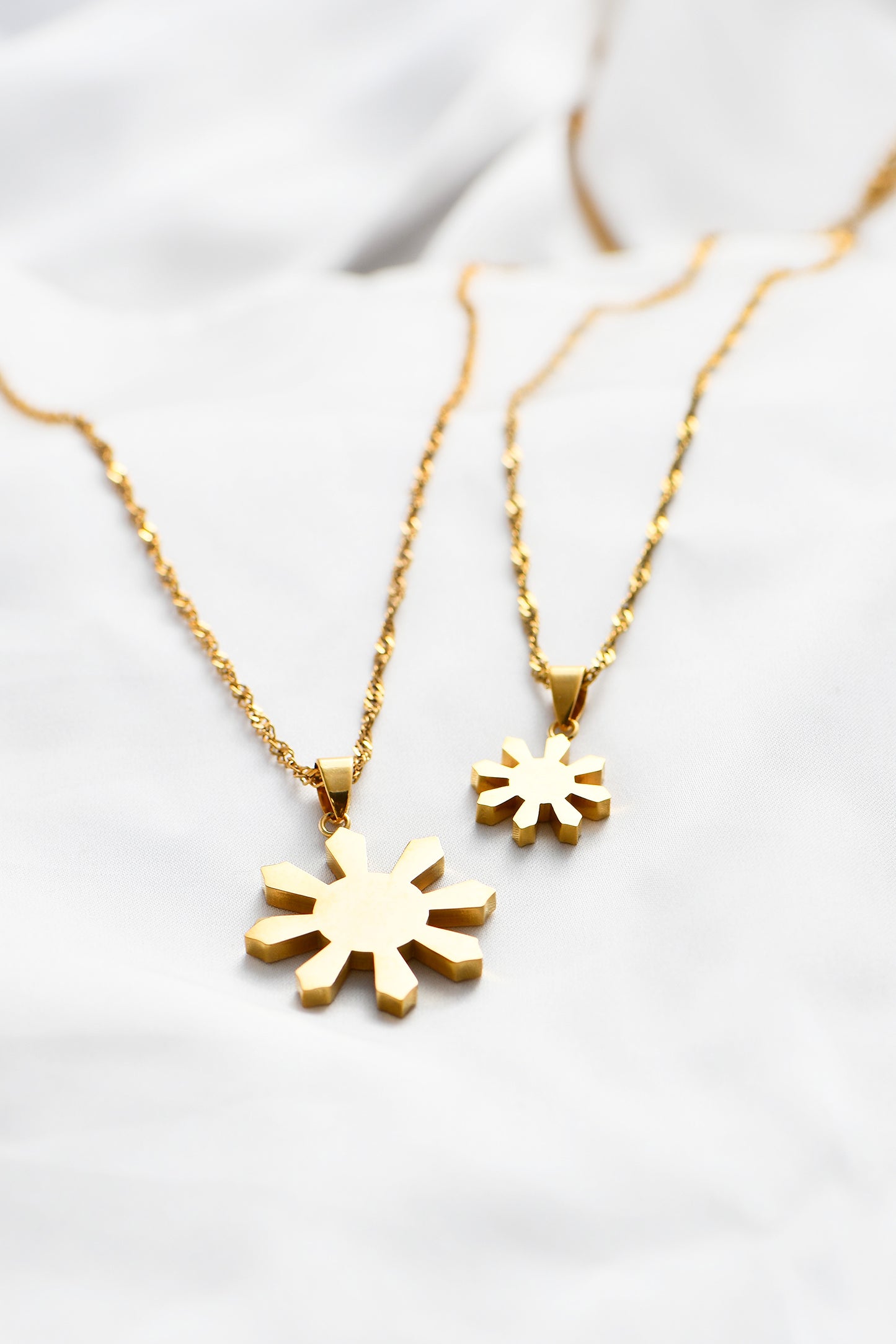 Mini& Classic Mabuhay Sun Pendant's on a white background. By DBL Jewelry