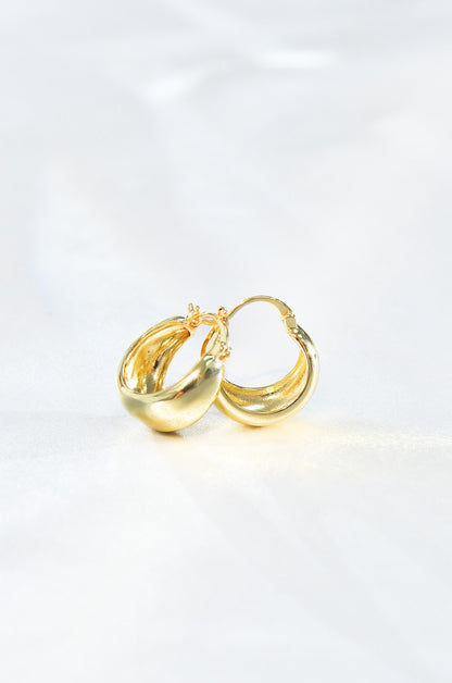 A pair of gold-filled mini dome hoop earrings on a white background. By DBL Jewelry