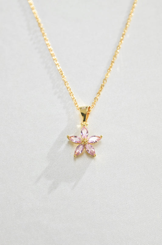 A gold-filled necklace with a pink flower-shaped pendant, a cherry blossom. Covered with 18K Gold Filling, made by DBL
