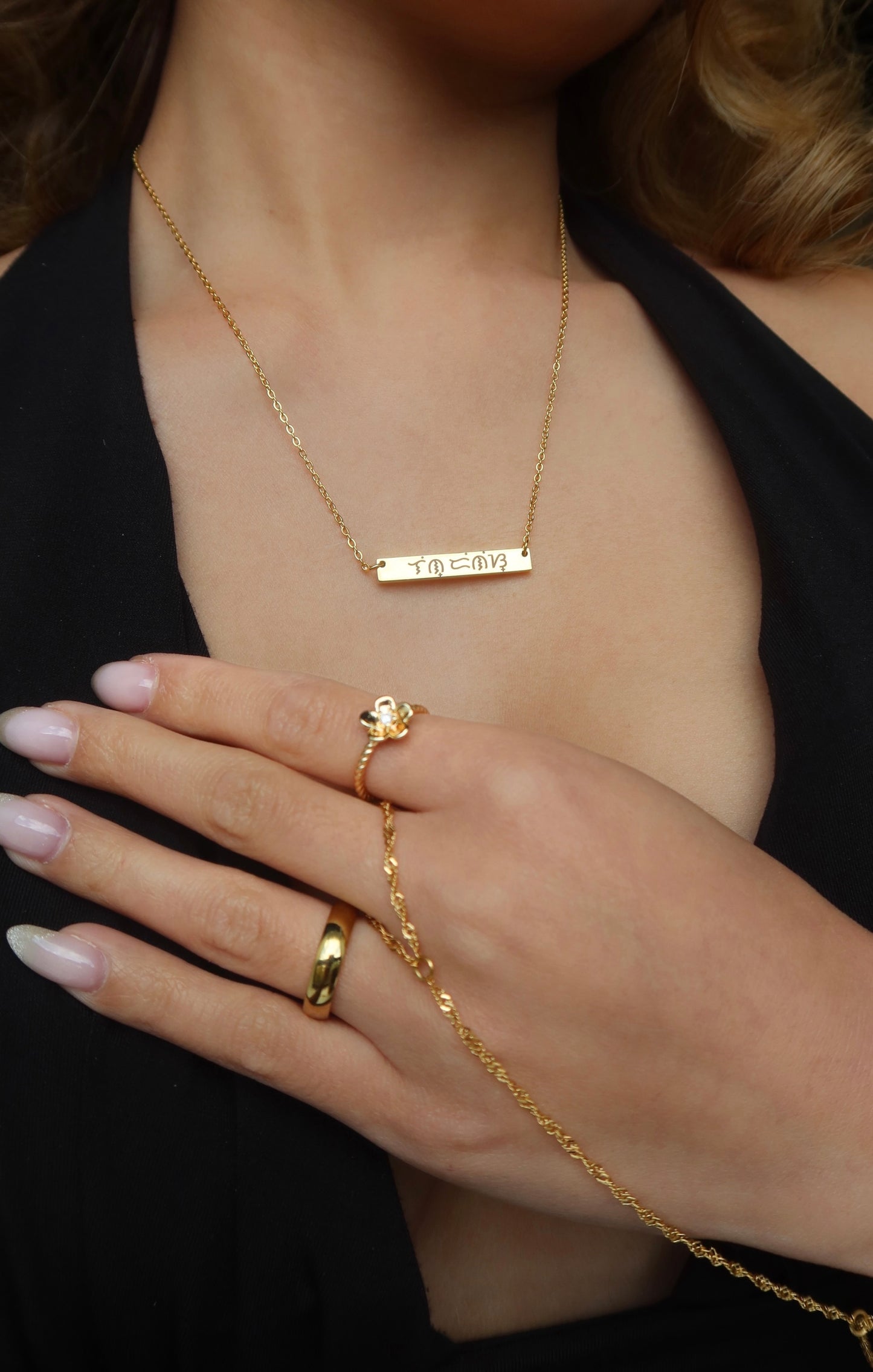 18K Electroplated Gold Stainless Steel Baybaying filipino script custom necklace on female model, piece of Filipino heritage as Baybayin is the ancient Filipino Writing System. Unisex Piece for Filipino Men and Women waterproof and Non-tarnish. by DBL Jewelry.