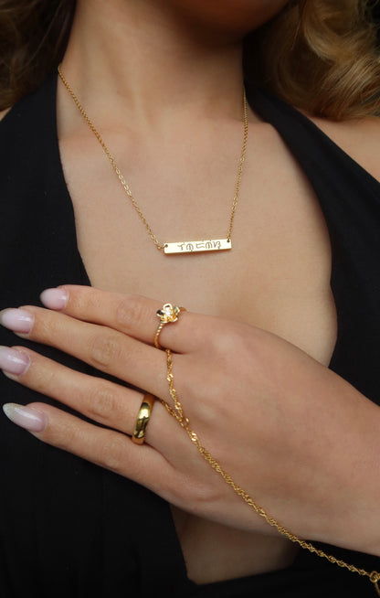 18K Electroplated Gold Stainless Steel Baybaying filipino script custom necklace on female model, piece of Filipino heritage as Baybayin is the ancient Filipino Writing System. Unisex Piece for Filipino Men and Women waterproof and Non-tarnish. by DBL Jewelry.