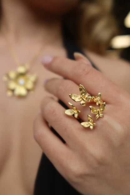 Hand Model wearing Paru Paro Ring, 18K gold plated butterfly ring symbolizing transformation, protection, and Filipino beauty.by DBL JEWELRY.